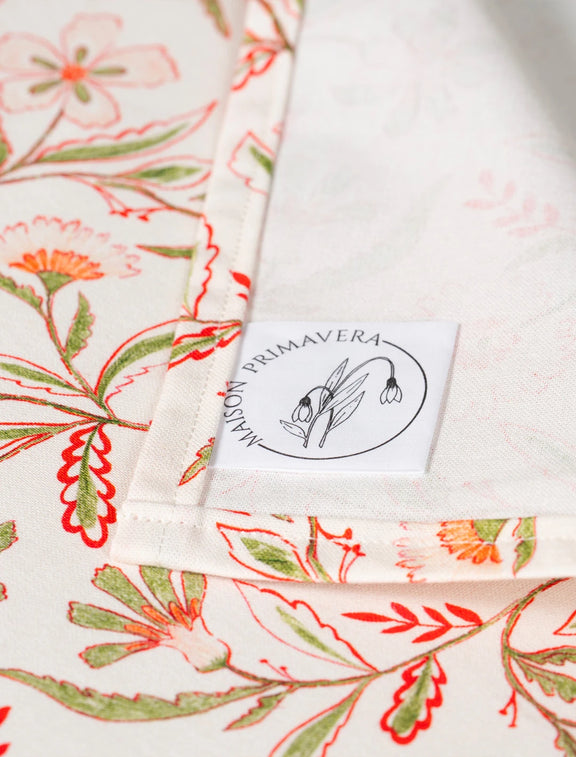 Etiquette d'une nappe fabriquée en France en coton et en lin, motif floral